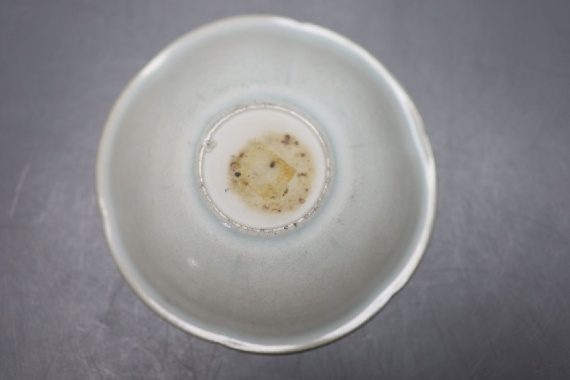 An 18th century Chinese famille rose tea bowl, together with a Qingbai type bowl and dish, largest diameter 17cm